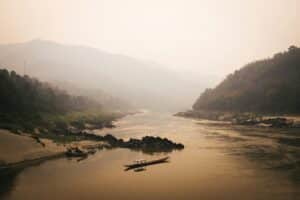 Riverbased management scene in a river basin in Asia. Parker Hilton photo. Unsplash.